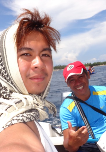 Our photographer during the banana boat ride at Blue Coral Beach Resort, Laiya San Juan, Batangas.